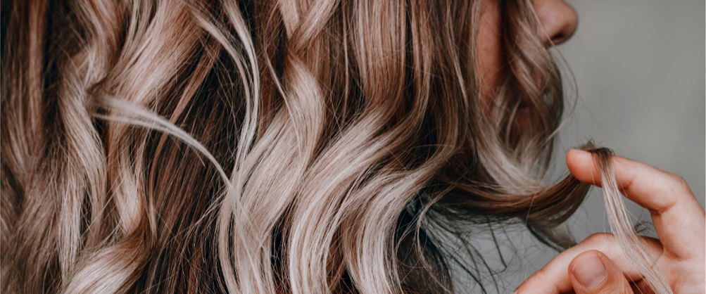 style your hair to achieve volume